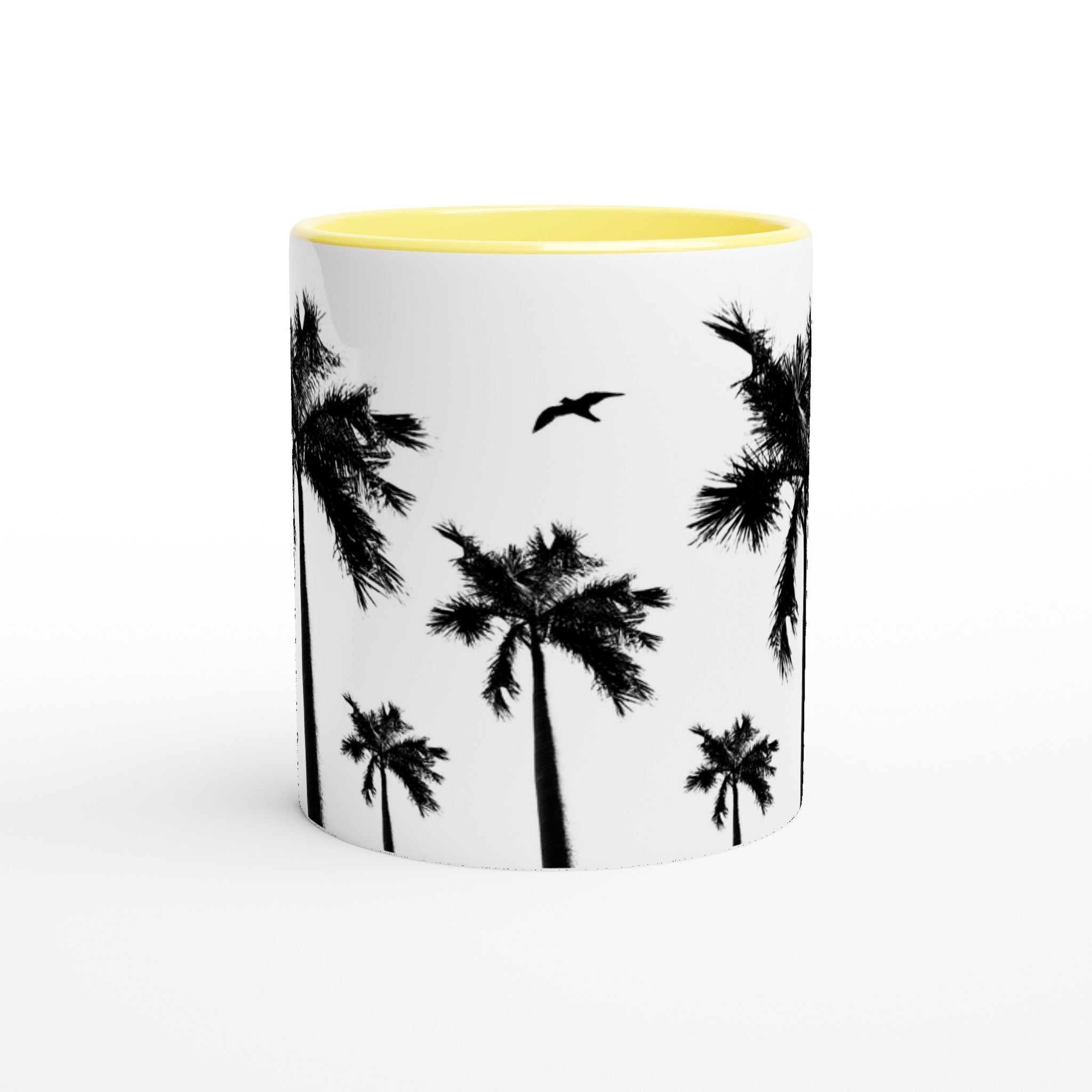 Weiße Keramiktasse mit Palmen-Motiven, Vogel, gelber Innenfläche und gelbem Henkel