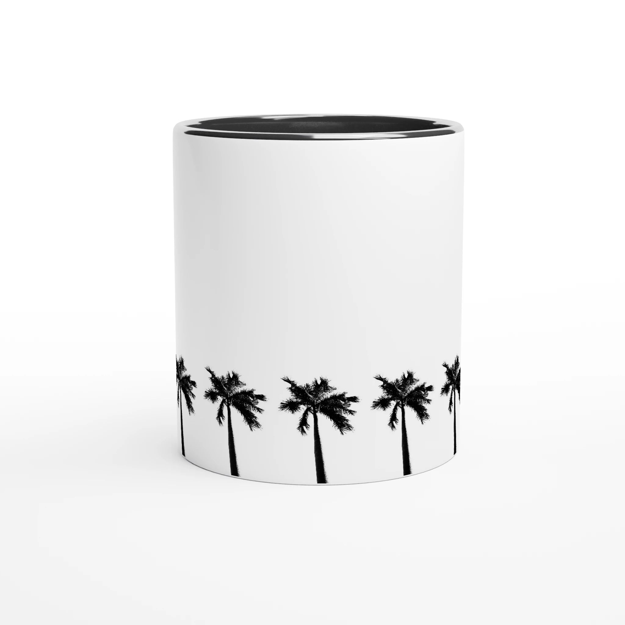 Keramiktasse mit umlaufender Palmenreihe und schwarzer Innenfläche